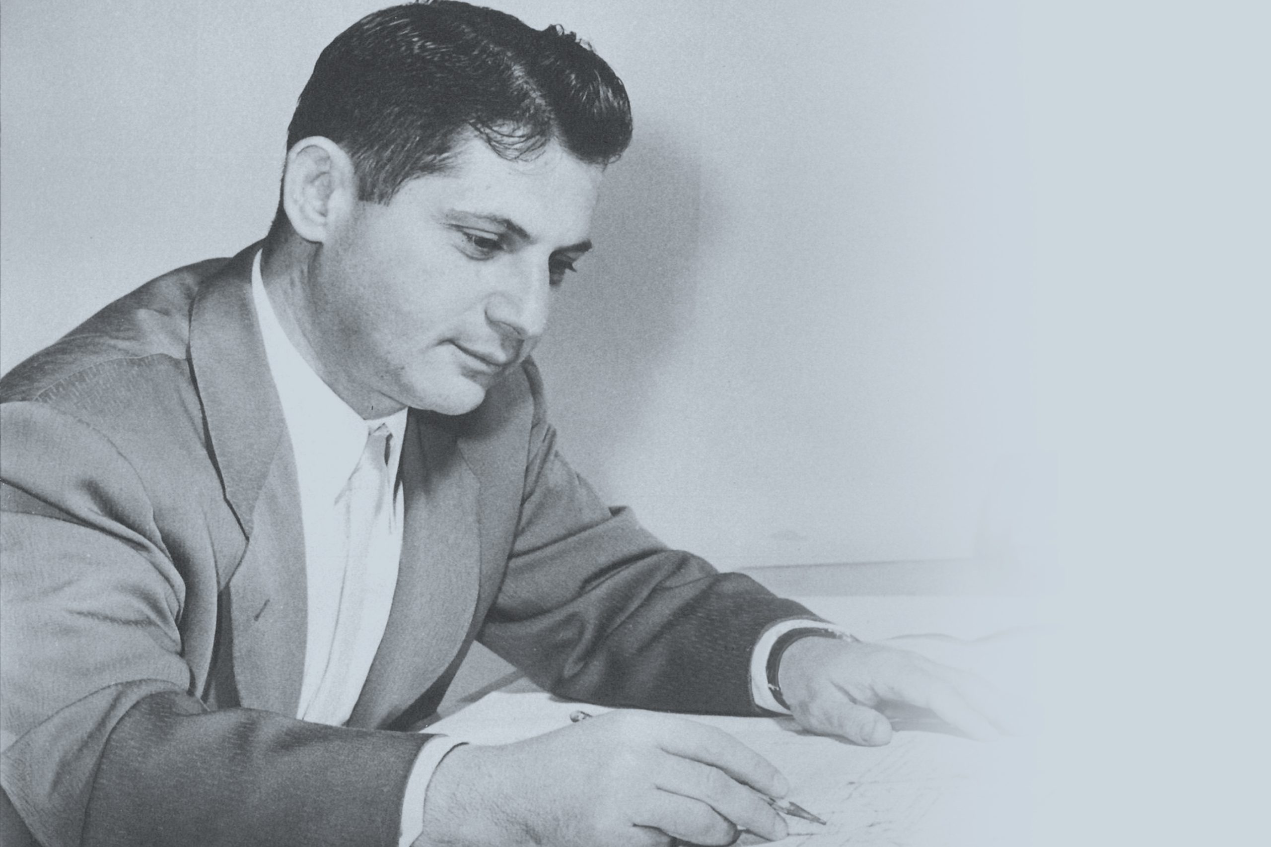 Men writing on paper