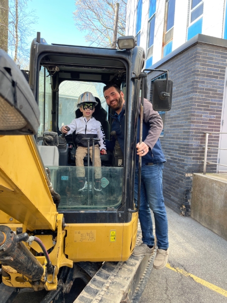Benderson Development child in excavator machine with adult